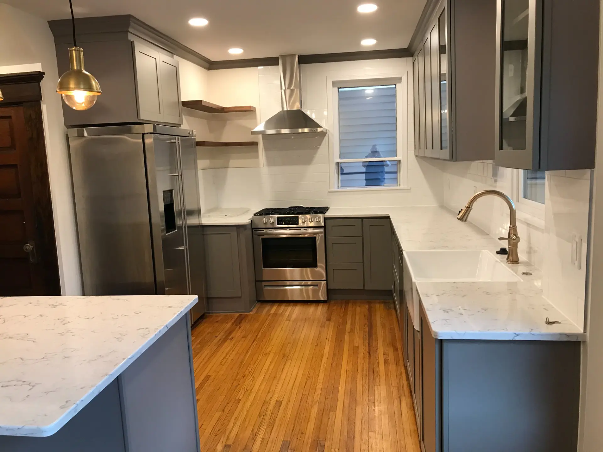 Warm Grey Cabinets with Blue Island