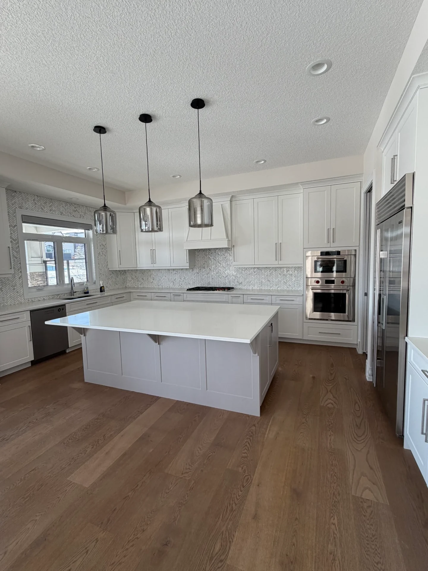 Bright White Kitchen with Oversized Island